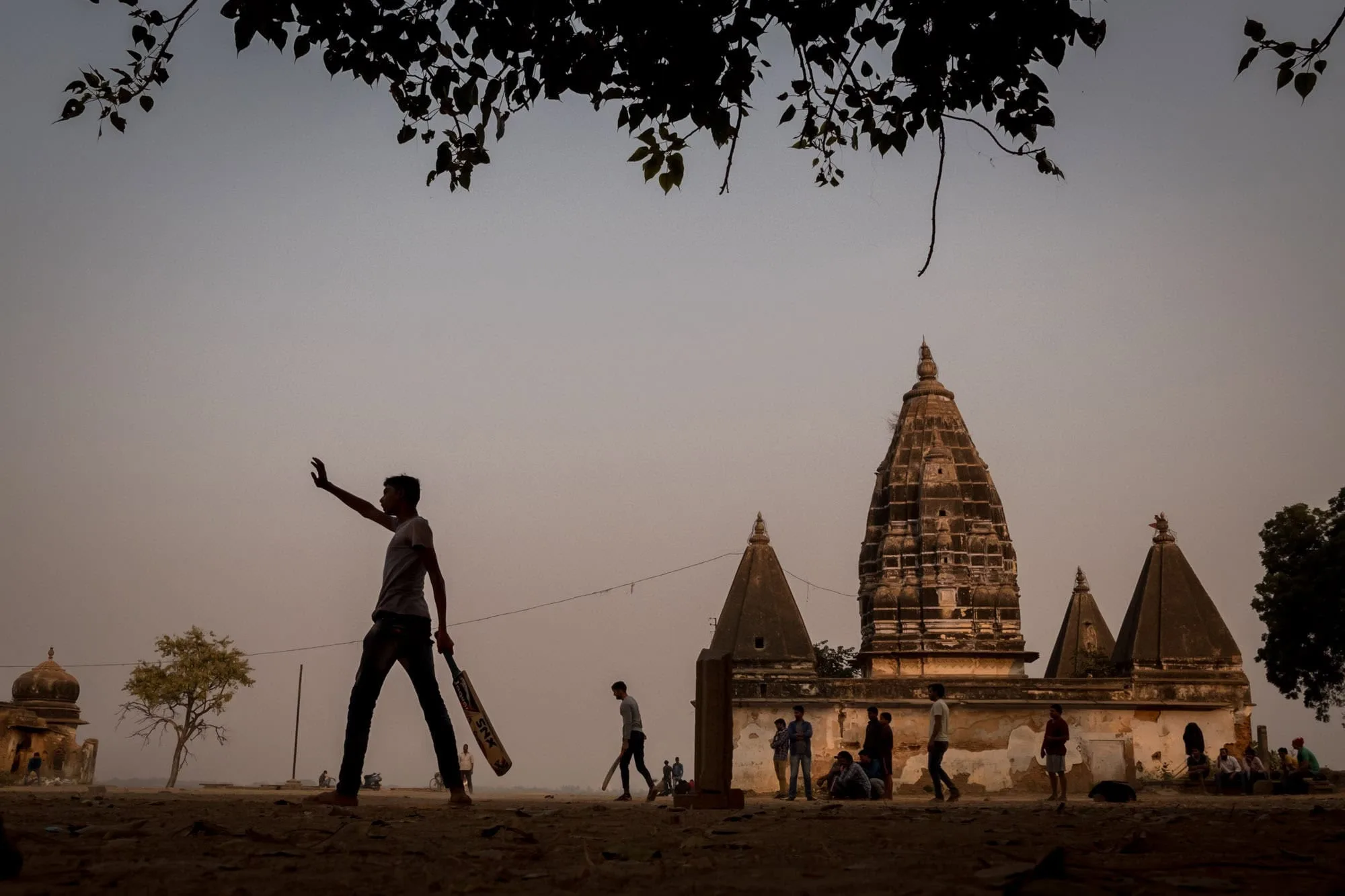 boys playing cricket in the street in Varanasi