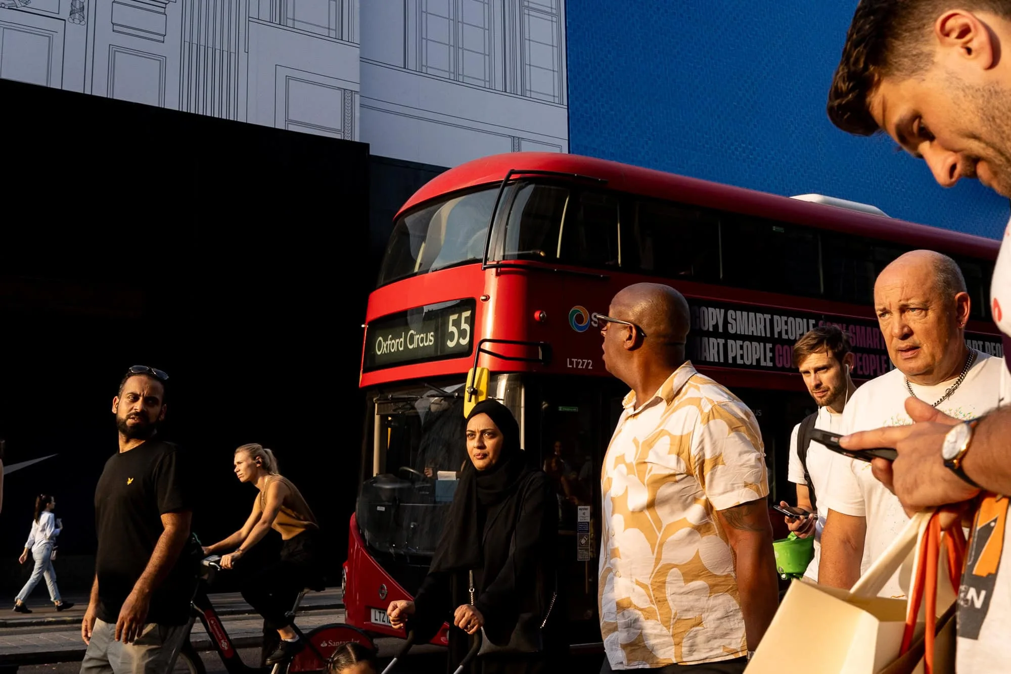 street photo of people and London bus on Oxford Street